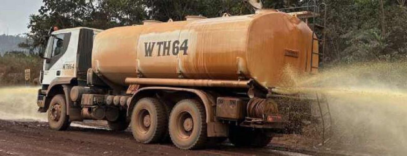 Biological dust control is sprayed on the road to create a rock hard layer by means of bio-cementation