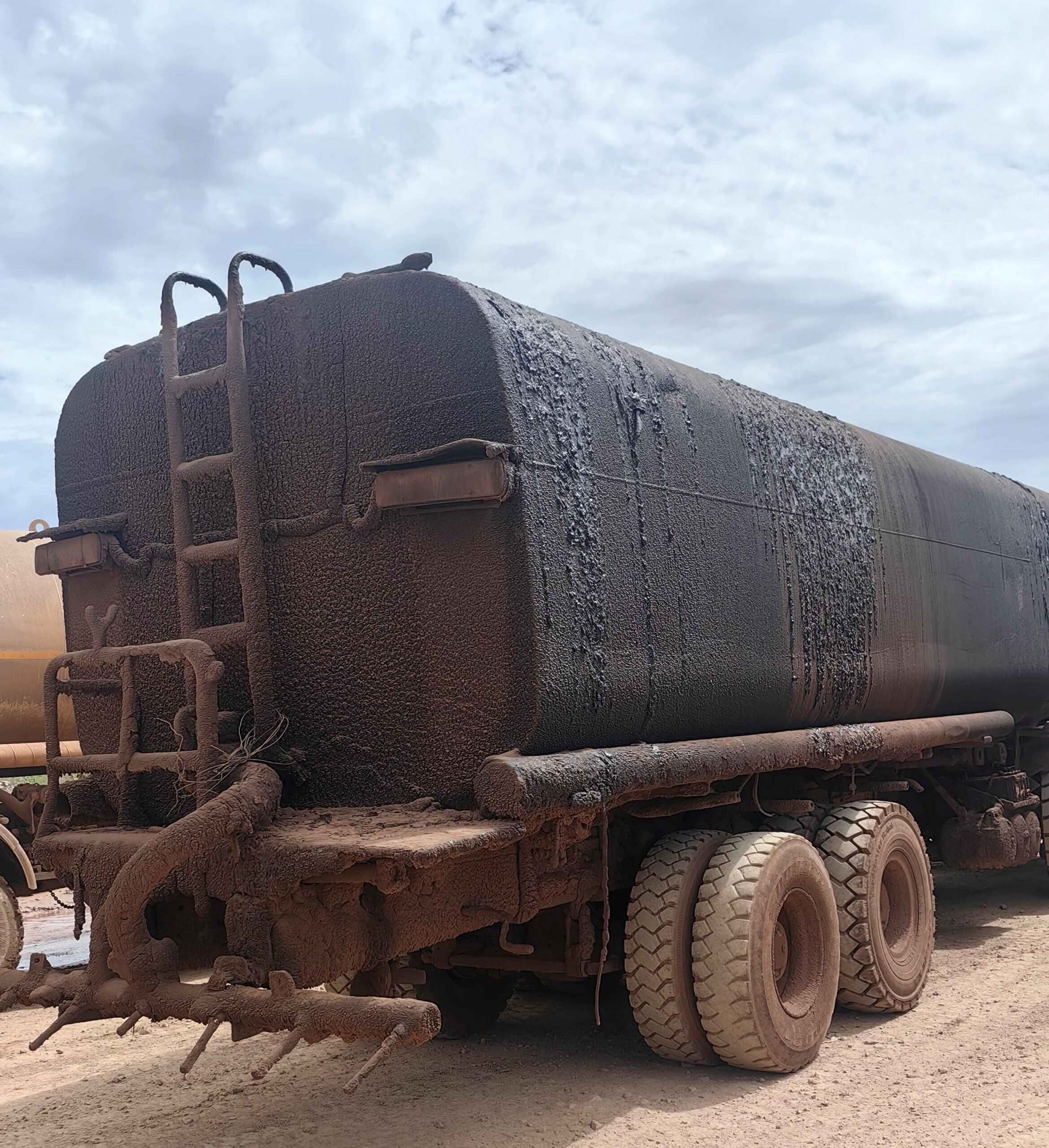 damaged water bowser used to control dust with bitumen emulsion